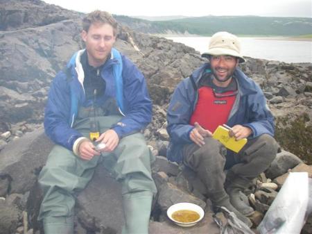 Seth Burgess (left) and Ben Black (right) having lunch on an outcrop by the Kutoy River.